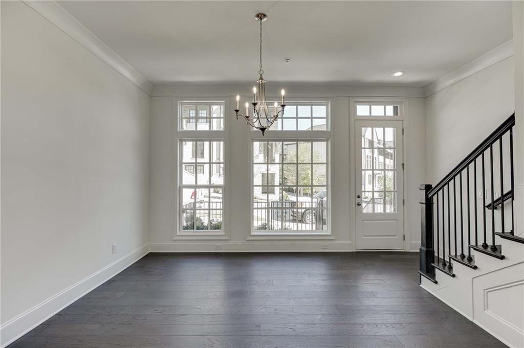 The Dining Room in this home has great natural light with transom windows above!