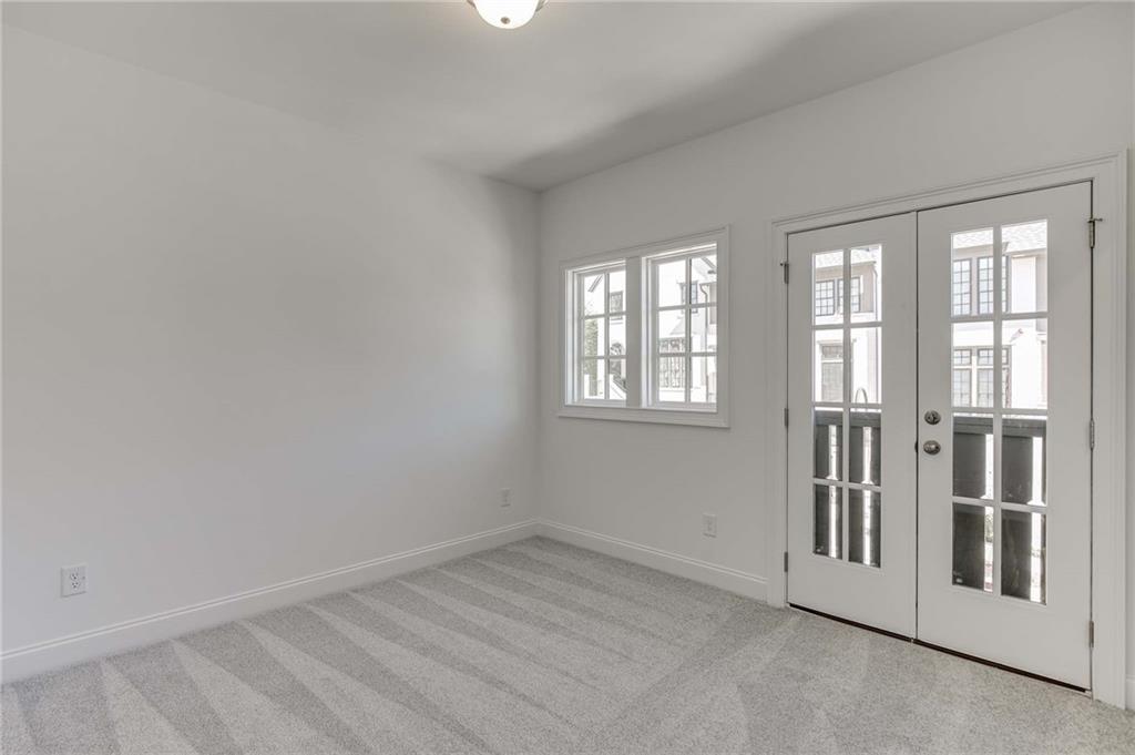 The secondary bedroom upstairs has a private ensuite bath.