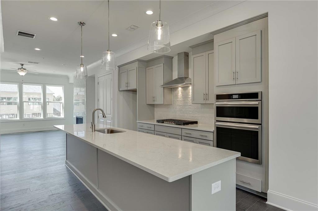 Gorgeous light grey cabinetry with upgrade quartz countertops!