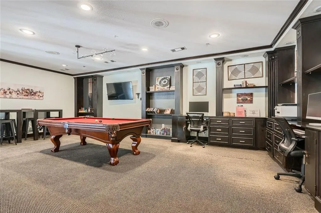 Recreation room with crown molding, light colored carpet, recessed lighting, pool table, and an office area