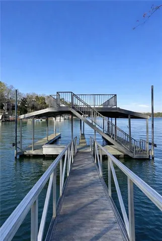 Dock area featuring a water view