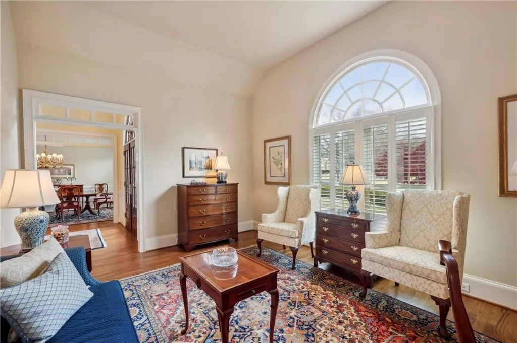 Living room boasts beautiful arched window