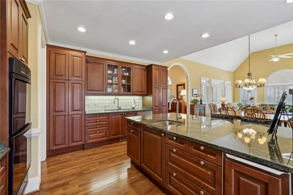 Custom gourmet kitchen features subzero, ss appliances, double ovens, 2 sinks &  icemaker