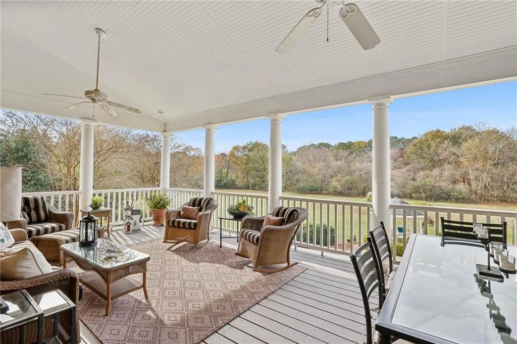 Relax on this custom covered porch with outstanding private views