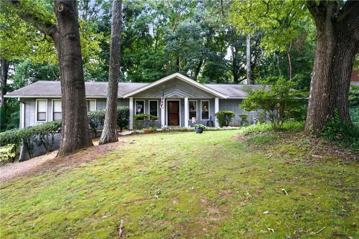 Ranch-style residence featuring a prominent front gable and a covered entry