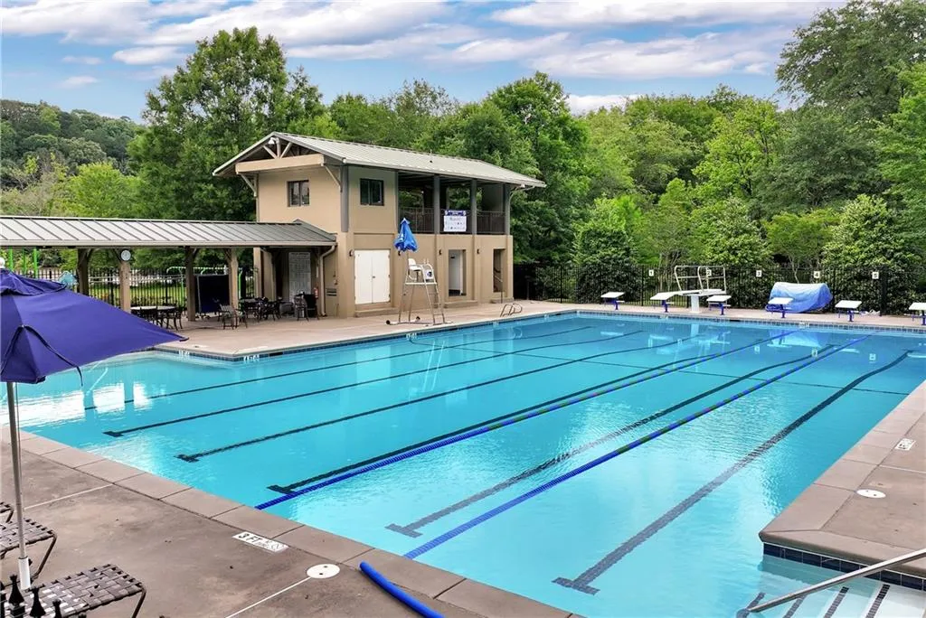 View of pool with a diving board