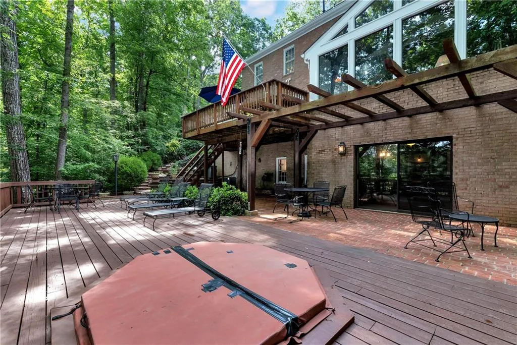 Wooden terrace featuring a pergola