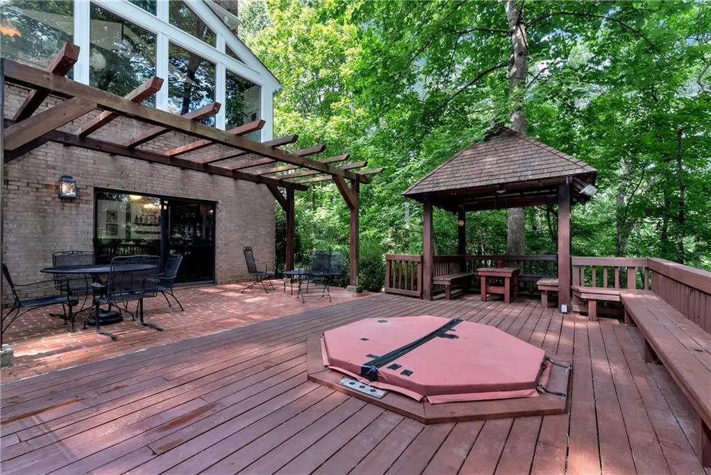 Wooden terrace with a pergola and a gazebo