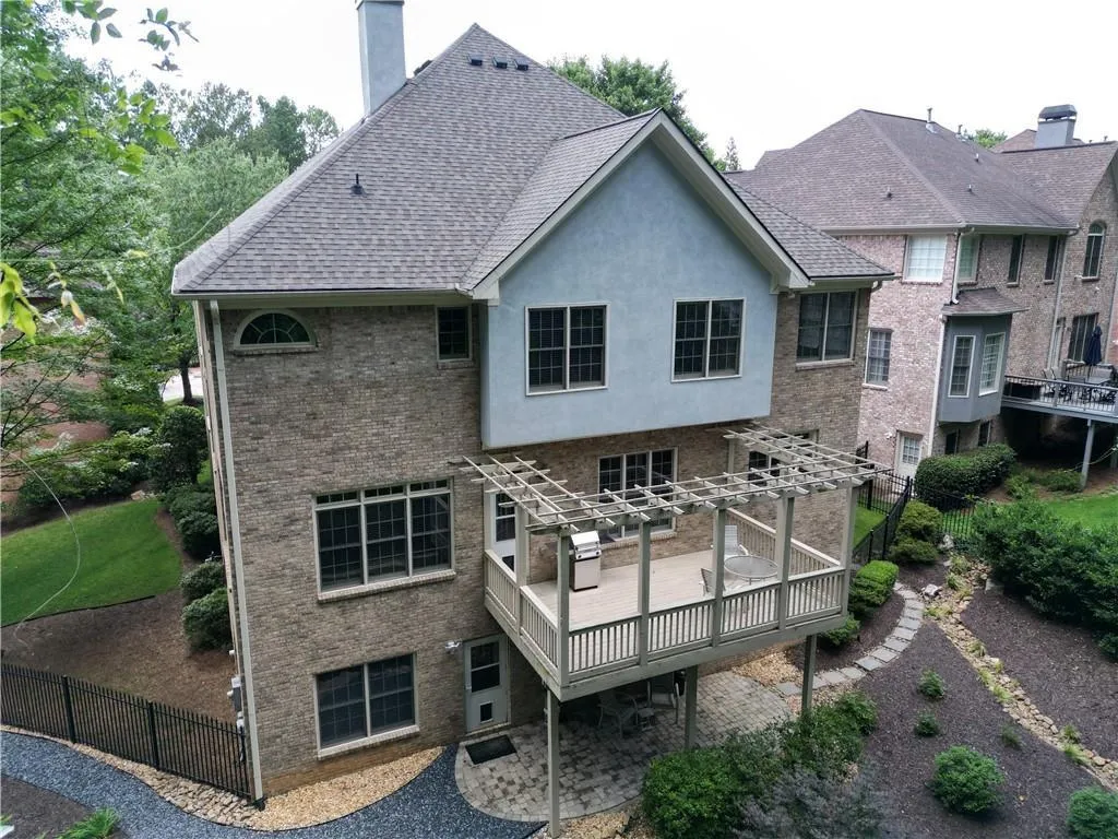 Back of house with a pergola