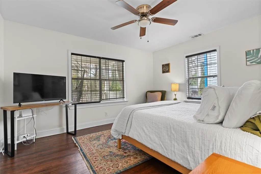 Bedroom with wood finished floors and ceiling fan