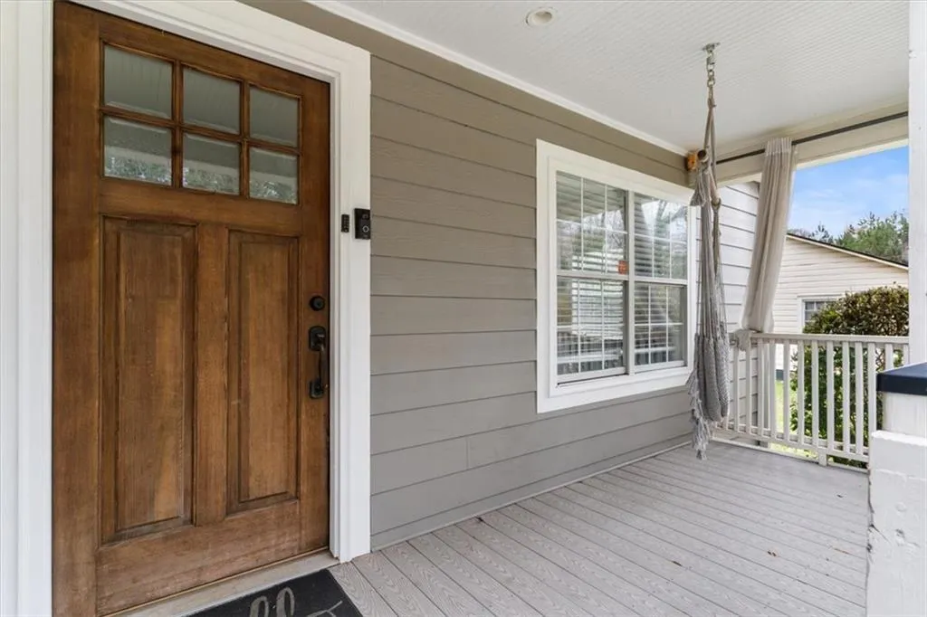View of entry featuring a porch