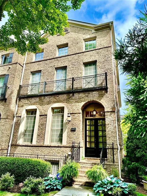 This townhome boasts a stunning exterior adorned with architectural details.