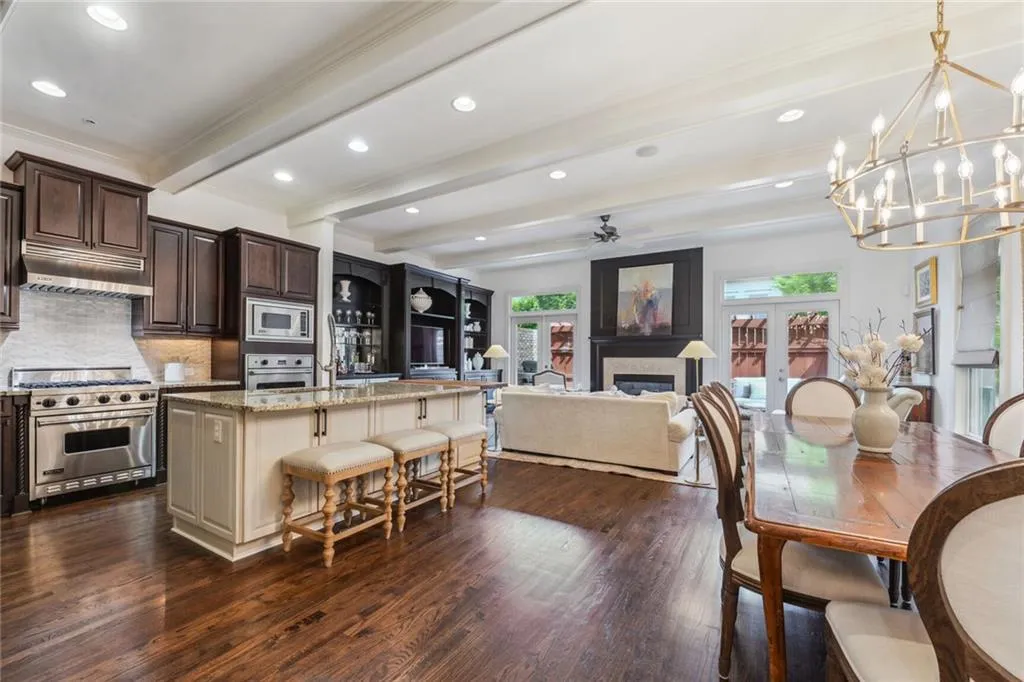Kitchen featuring Viking appliances, huge island with lots of storage space, and a wood beam ceiling