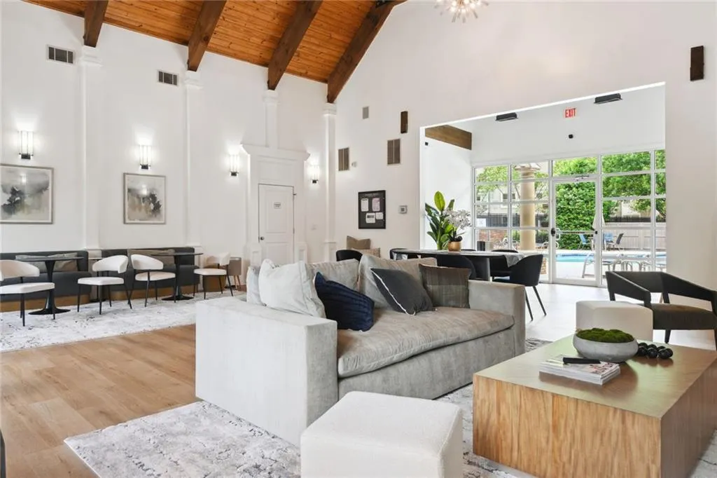 Neighborhood clubhouse includes a fitness room and catering kitchen and open to an outdoor patio overlooking the neighborhood pool area.