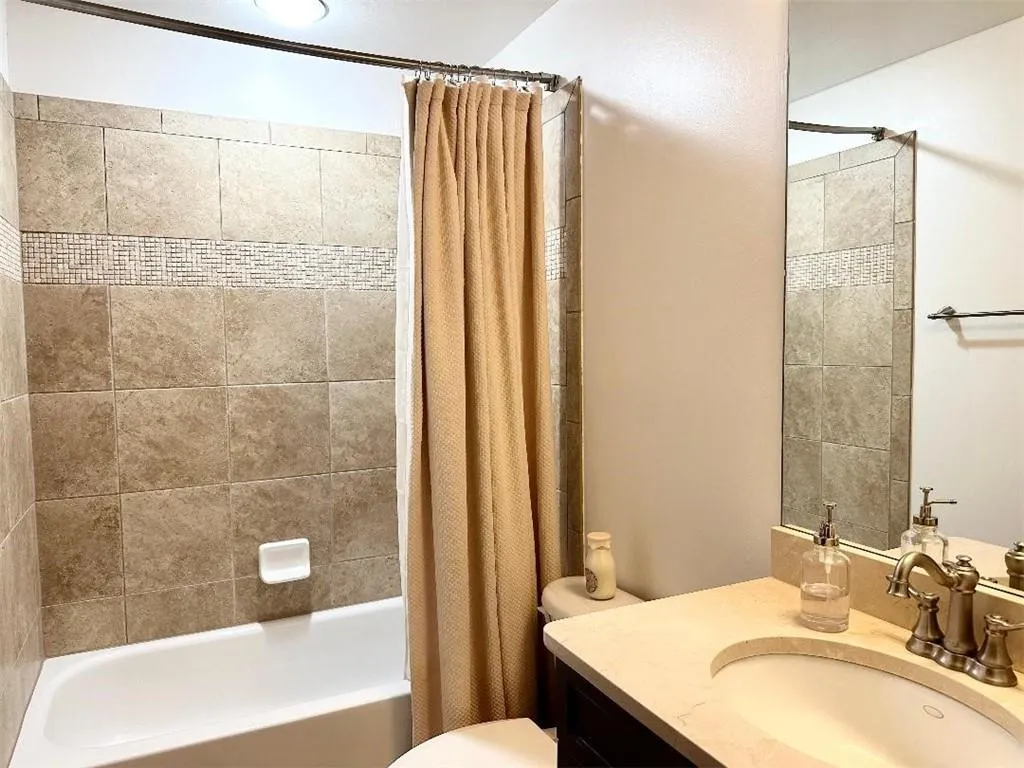 4th floor ensuite bathroom includes marble countertops.