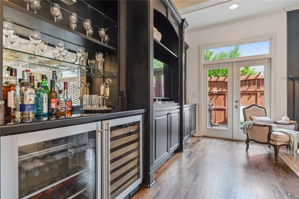 Bar includes a wine refrigerator and beverage refrigerator.