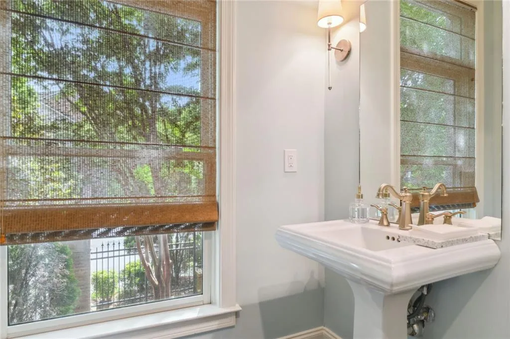 Bathroom includes Kohler fixtures and a wealth of natural light
