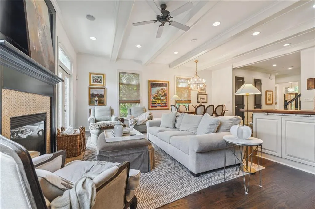 Living room featuring a gas  fireplace, and beam ceiling
