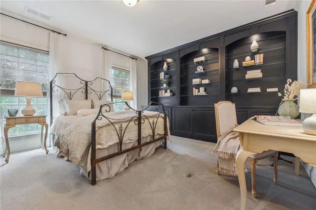 3rd floor secondary bedroom has stunning built in bookcases, an huge walk in closet, with built in closet shelving system.