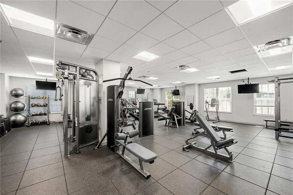 Gym with a paneled ceiling