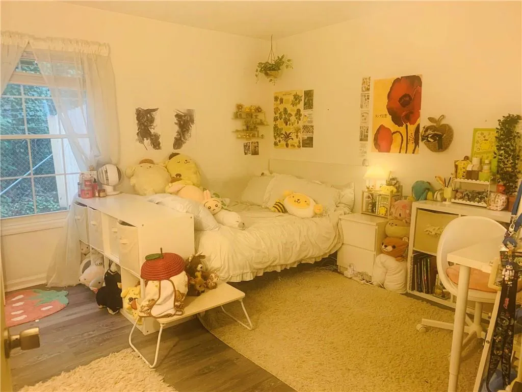 Bedroom featuring wood finished floors