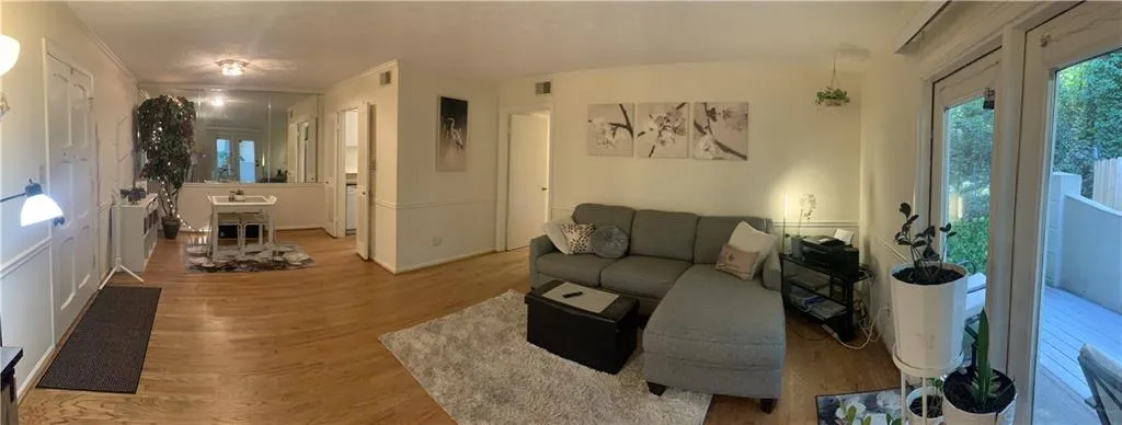 Living area with wood finished floors