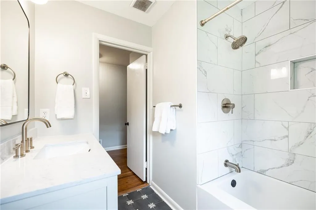 Bathroom with vanity and shower / bathtub combination