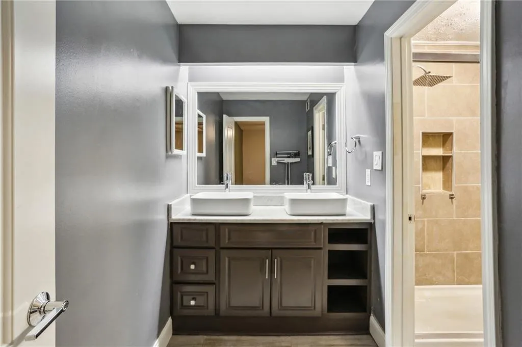 Updated primary bath provides tile flooring, quartz counter top and double sinks.