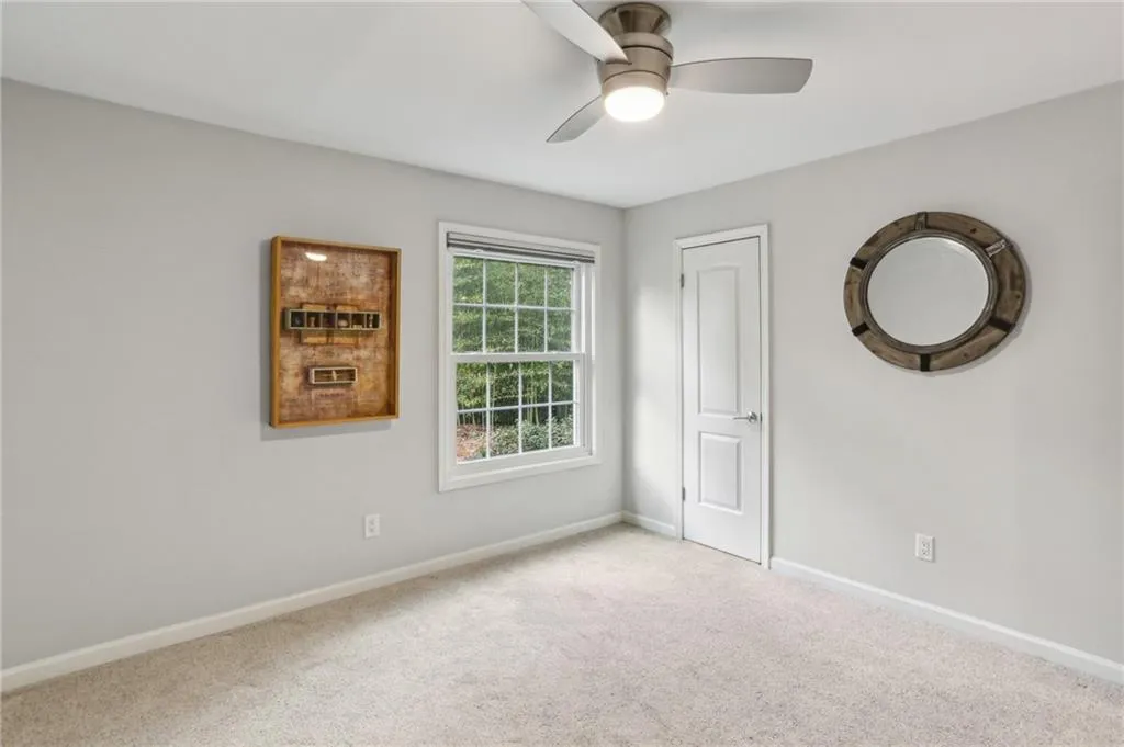 Large walk-in closet and ceiling fan with remote in the second bedroom.