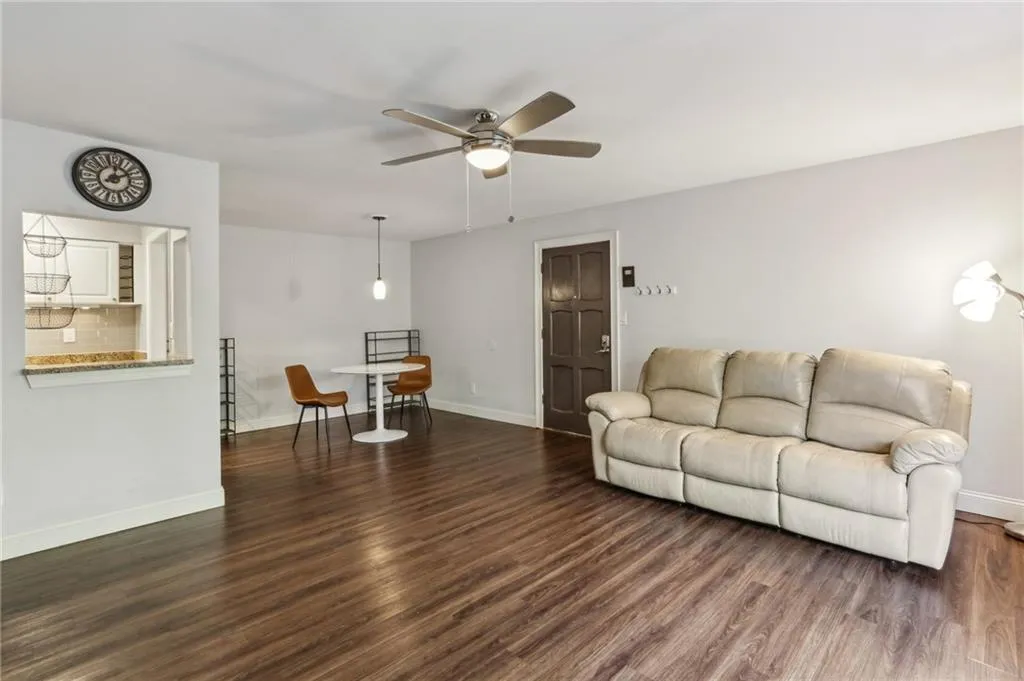 Open concept living and dining on LVP flooring.