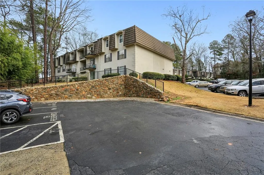 Reserved parking space at rear of building creates private entryway.