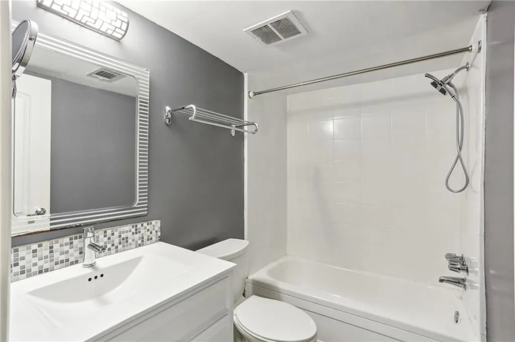 Second bath is updated with tile and ceramic.