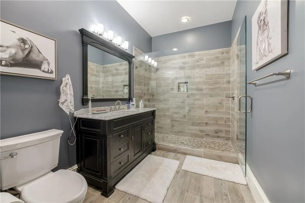 Dark wood-finish vanity with a stone countertop