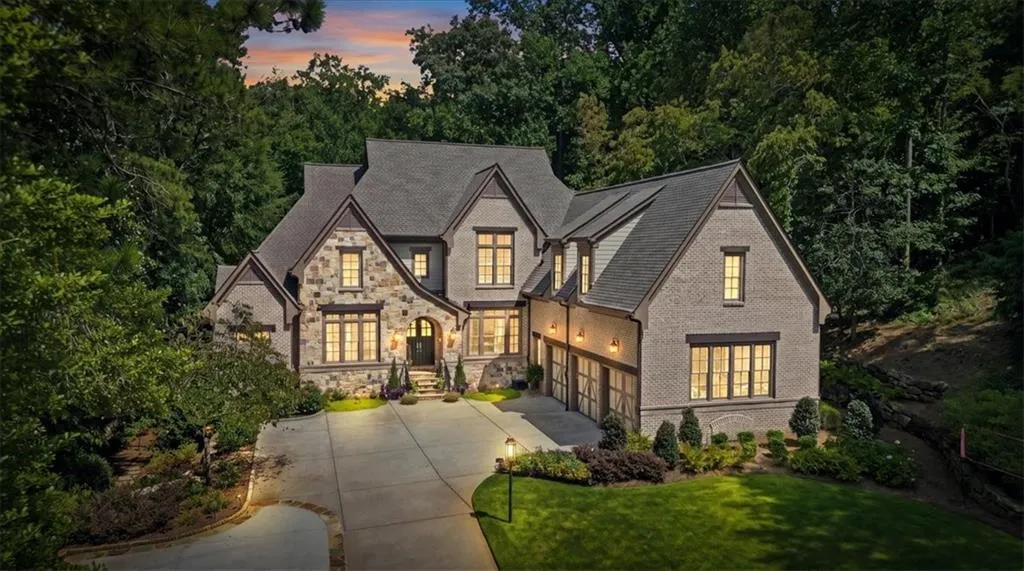 Stone and brick exterior with multiple gables and dormers