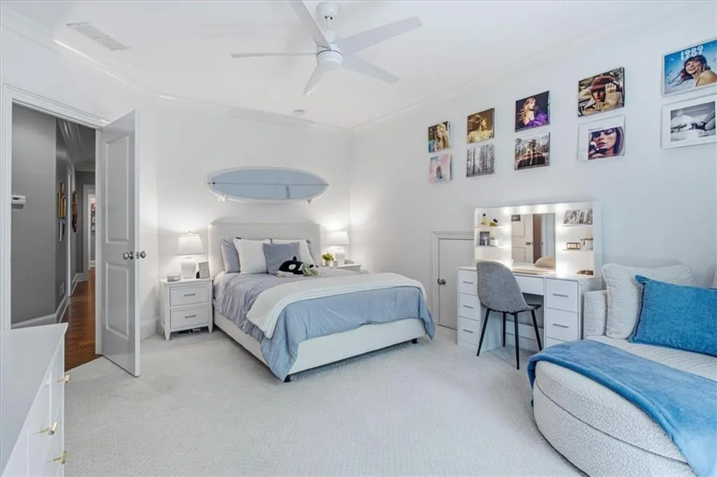 Recessed lighting, crown molding, ceiling fan, carpeted flooring, and built-in vanity with illuminated mirror