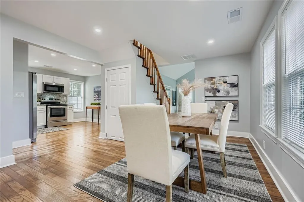 The great room is open to the kitchen and the sunroom.  There is a storage closet under the stairs.