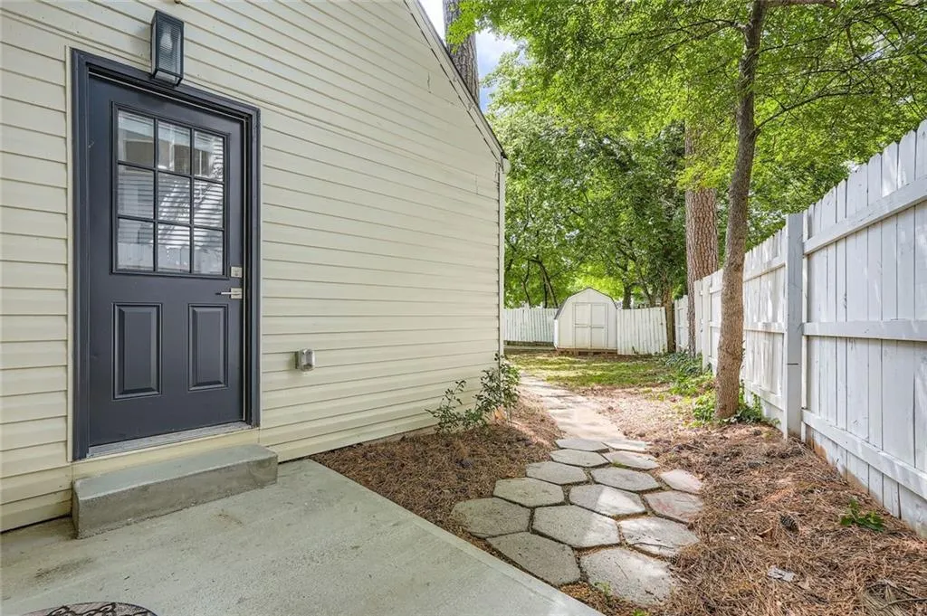 View of door leading to kitchen from back patio
