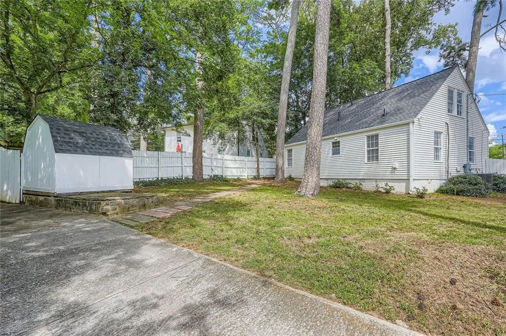This home on a 0.23 acre lot has a large, fully fenced back yard.  There is certainly room for a garden, room for play and room pets! Note the shed for extra storage.  The long driveway can comfortably accomodate up to three cars.