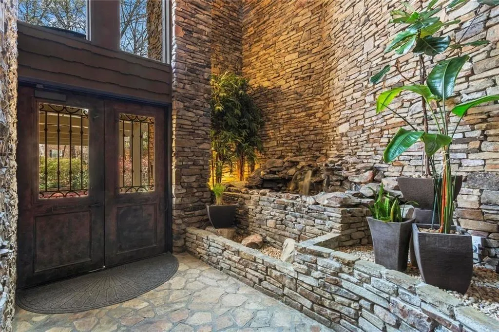 Building Lobby with soothing water feature and lush foliage