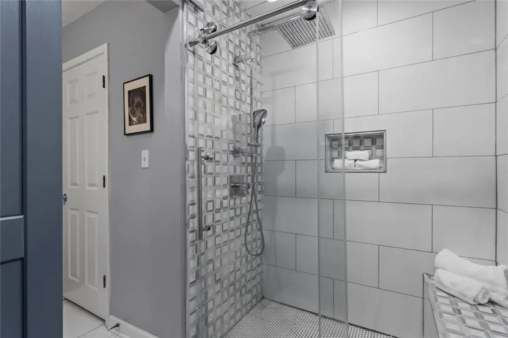 Primary bathroom with separate room for toilet and shower