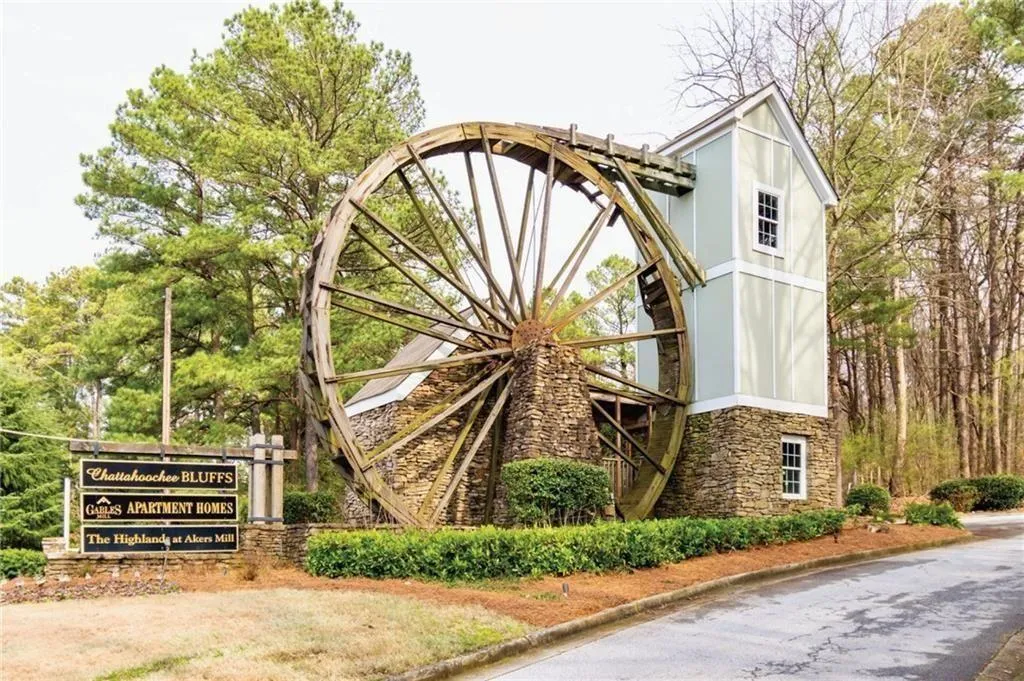 Iconic Waterwheel at entrance to Highland Bluff Community at Akers Mill Road