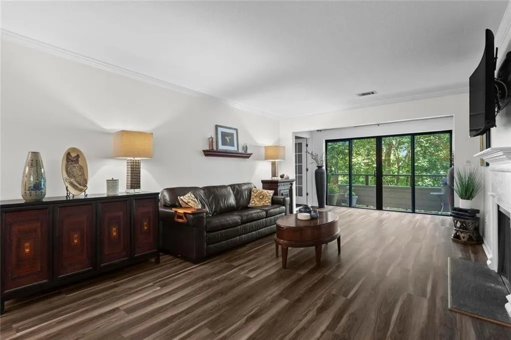 Living Room extends to patio with floor to ceiling windows.