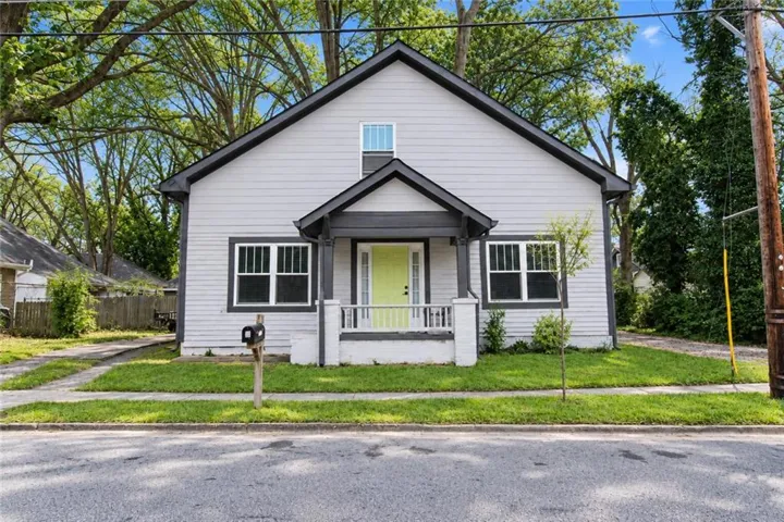 Light gray siding exterior with dark trim accents