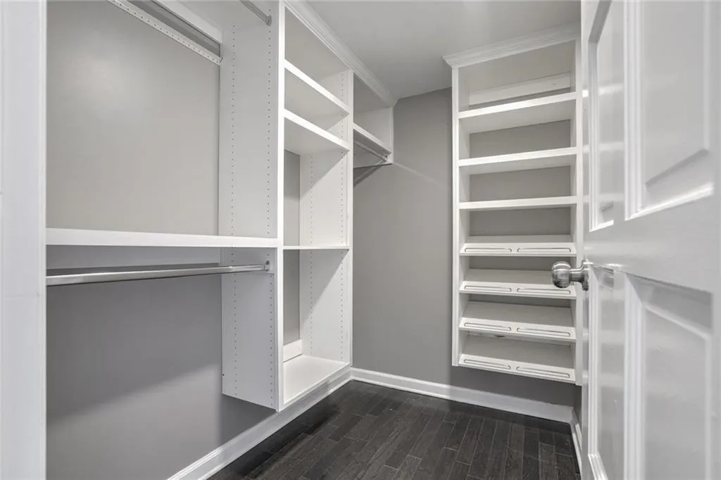 2 or 2 Walk-in Closets with closets systems.