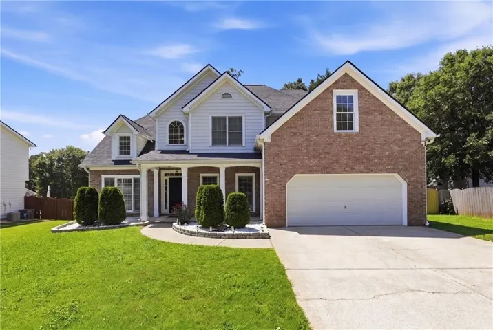 Brick and siding exterior with a gabled roof