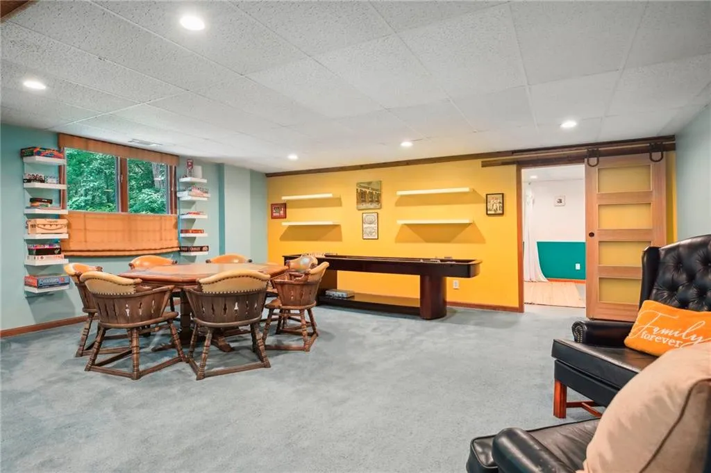 Carpeted dining area with built in features