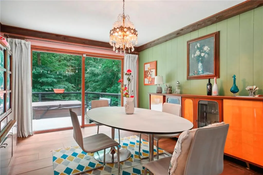 Dining room featuring a notable chandelier and wood-type flooring