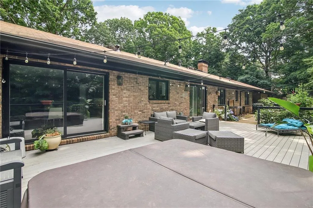 View of terrace with an outdoor living space and a wooden deck