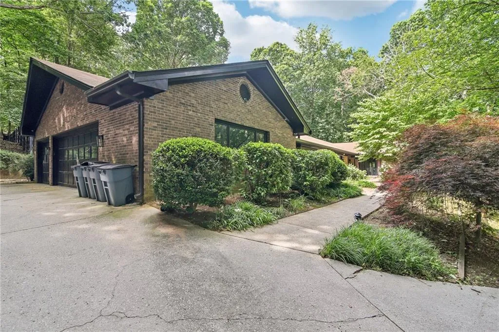 View of property exterior with a garage