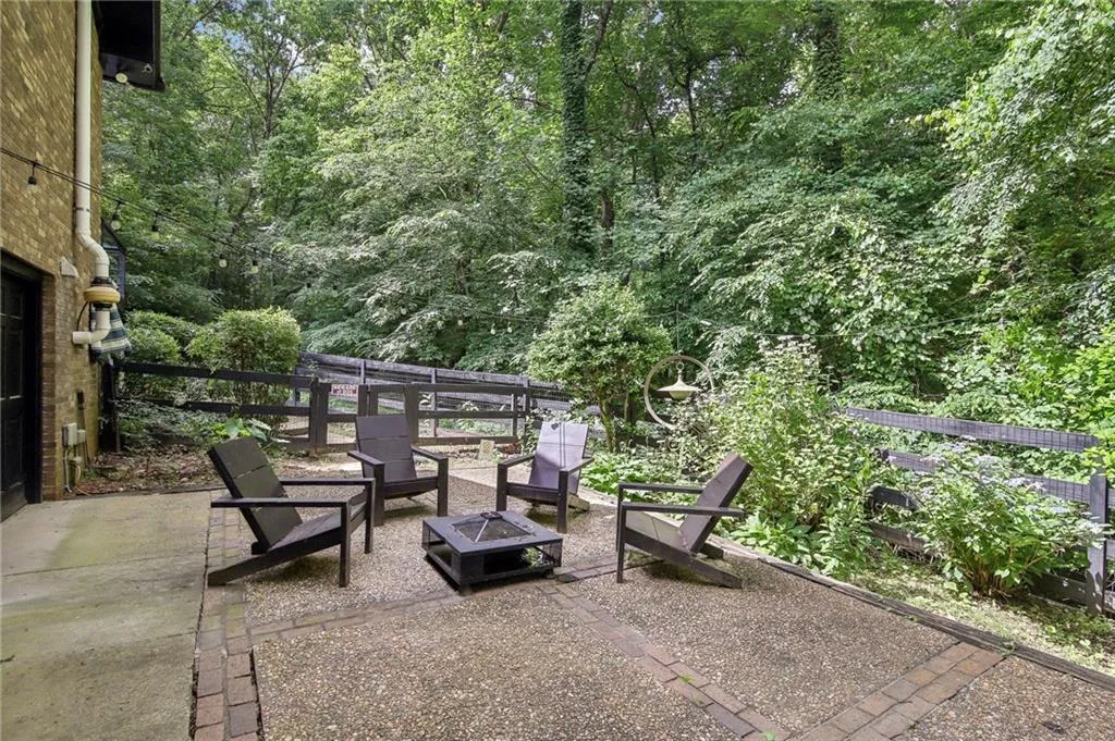 View of patio with an outdoor fire pit